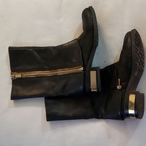 Black leather Vince Camuto boots.